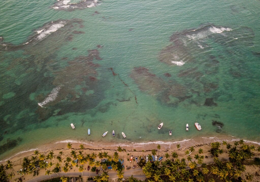beautiful overhead shot sea coast with some small boats parked near shore