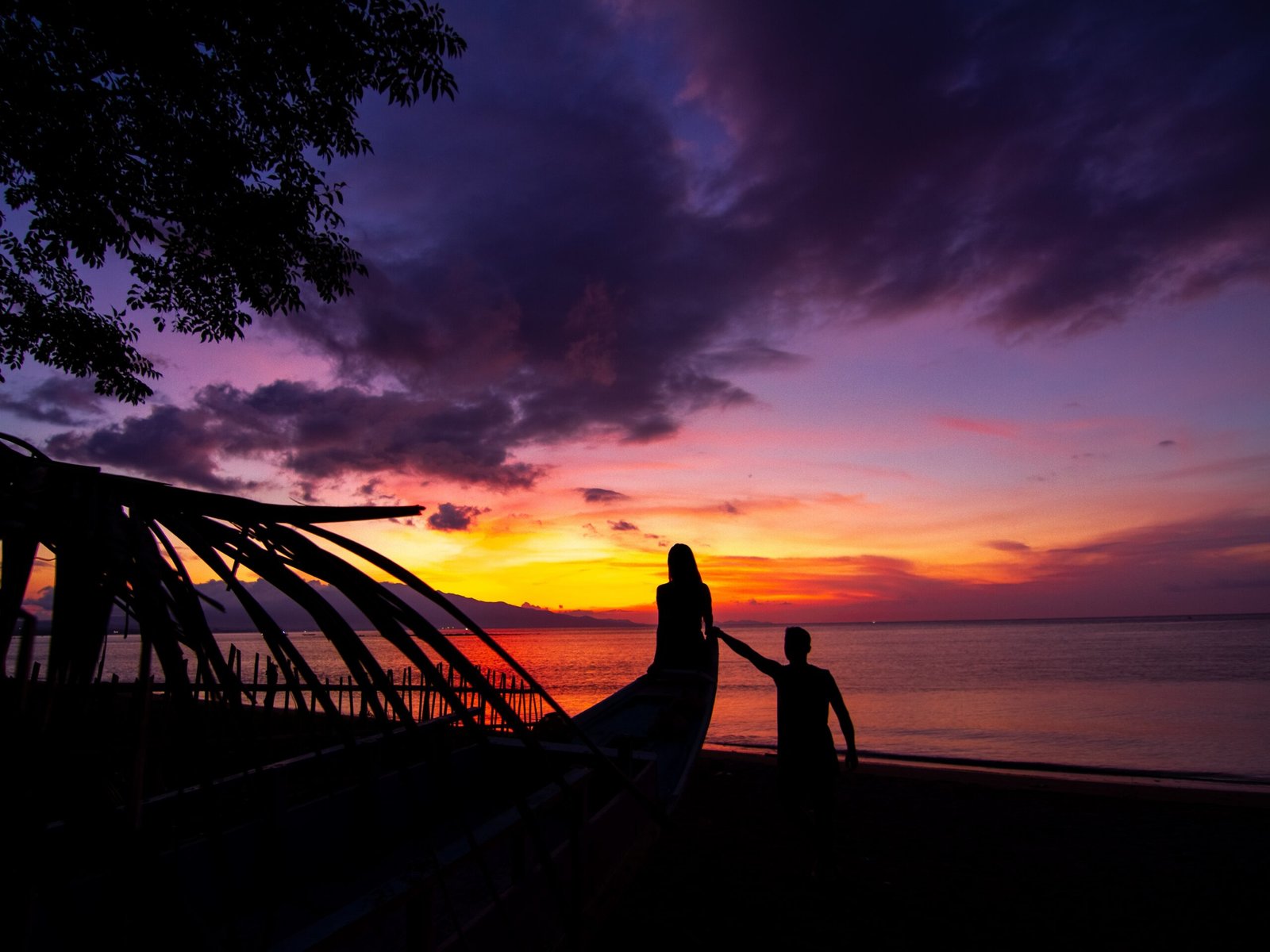 Couple enjoying serene monsoon views from Villa Infinity's private terrace overlooking the Arabian Sea
