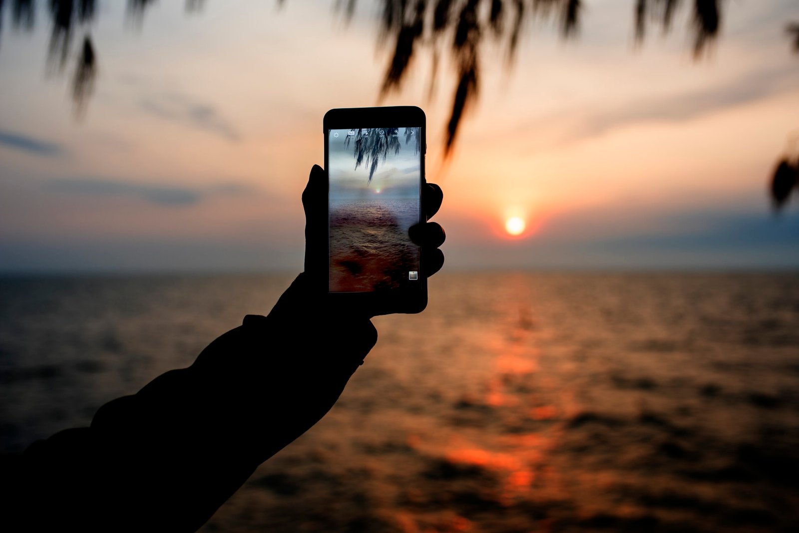 taking photo beach memories scaled