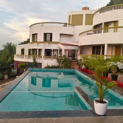 Scenic infinity pool surrounded by tropical greenery at Villa Infinity, Karde Beach